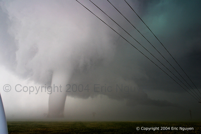 Blue-green supercell with a tornado, wall cloud, and tail cloud, in Big Springs, NE, 2004-06-10, credit Eric Nguyen, courtesy Corbis Corporation.
