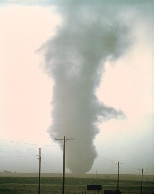 Tornado with turbulent flow beginning just above the surface near Watkins, CO, courtesy NCAR.